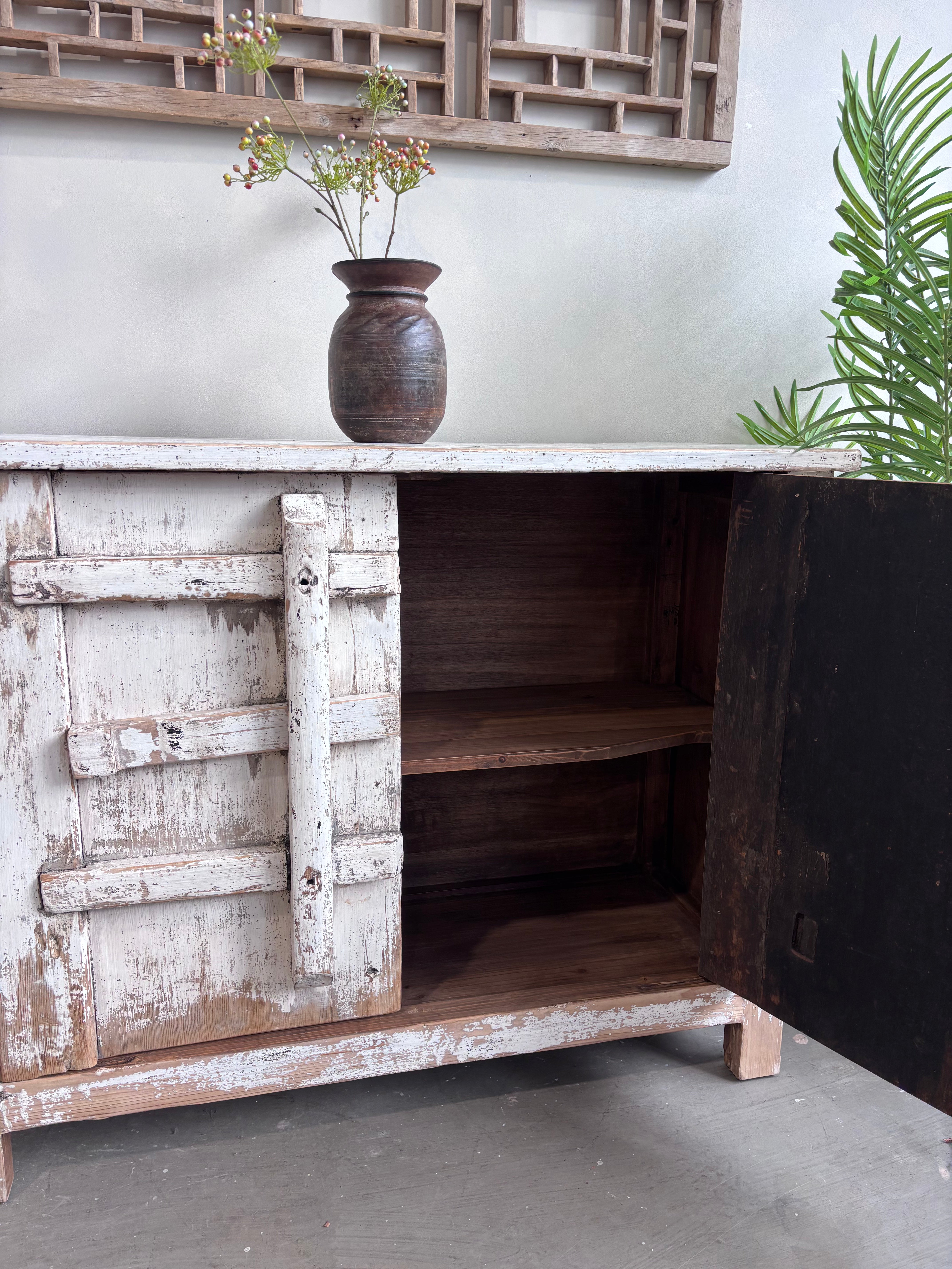 Distressed White Two Door Elm Cabinet with Unique Doors