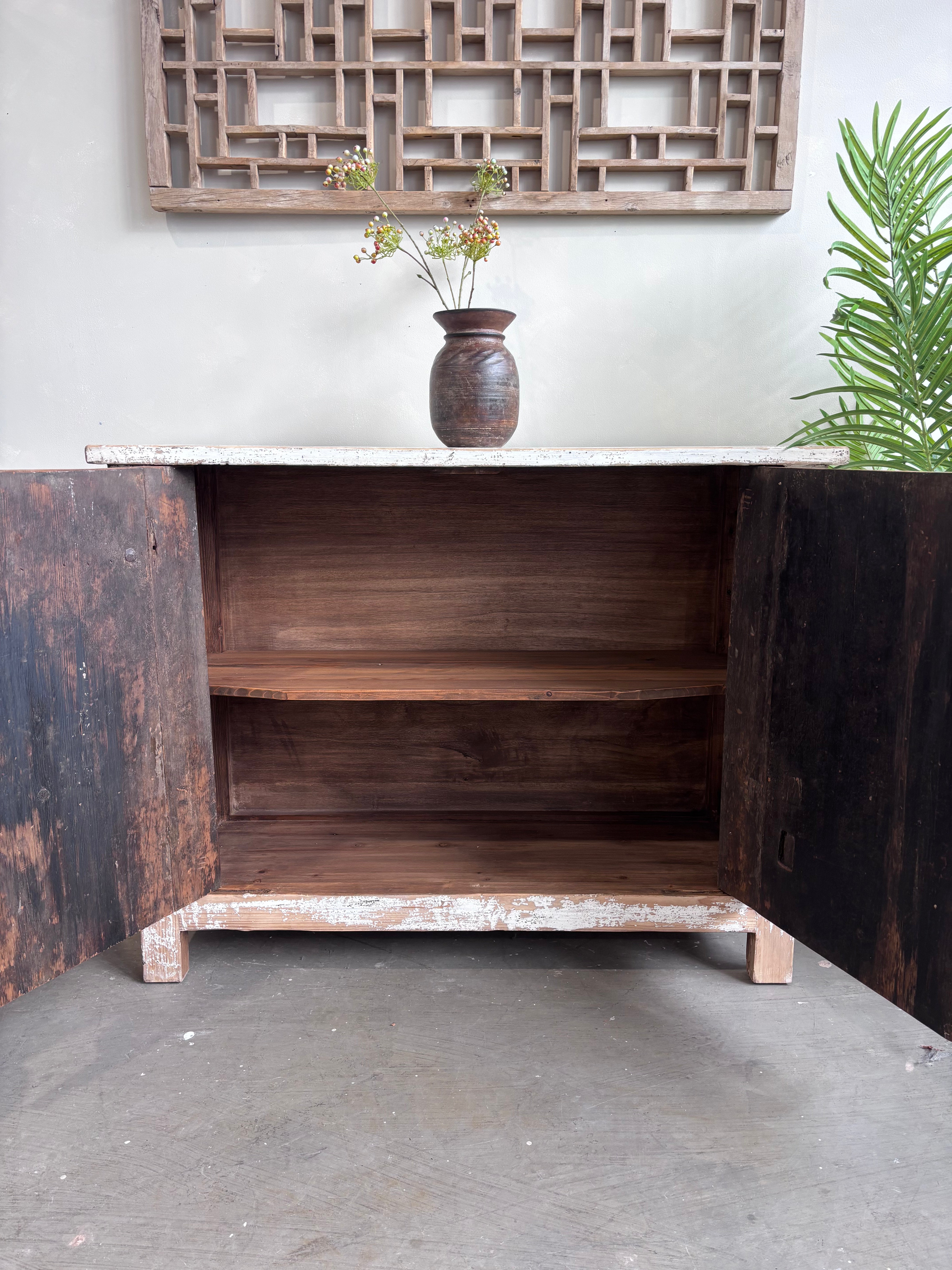 Distressed White Two Door Elm Cabinet with Unique Doors