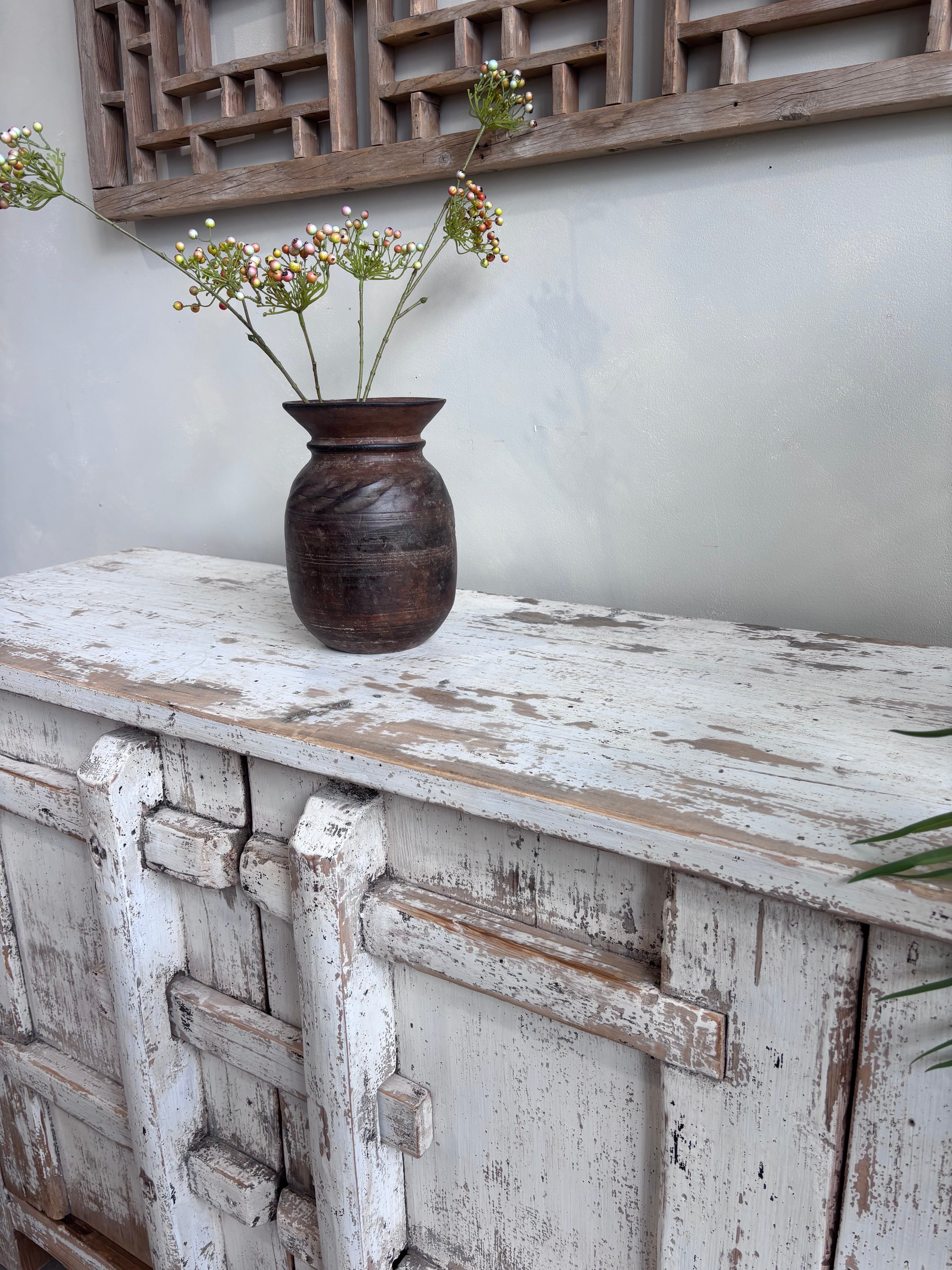 Distressed White Two Door Elm Cabinet with Unique Doors