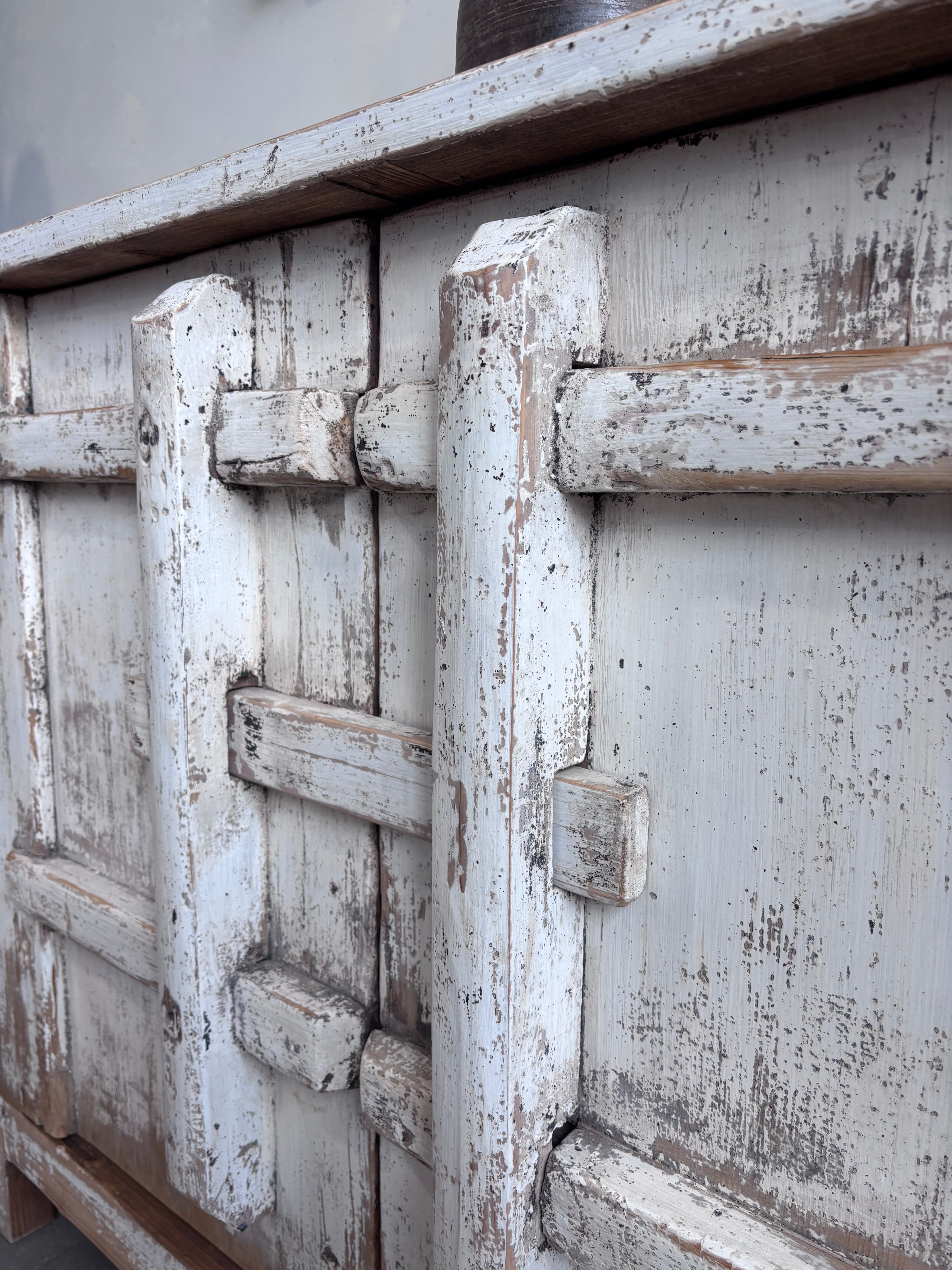 Distressed White Two Door Elm Cabinet with Unique Doors