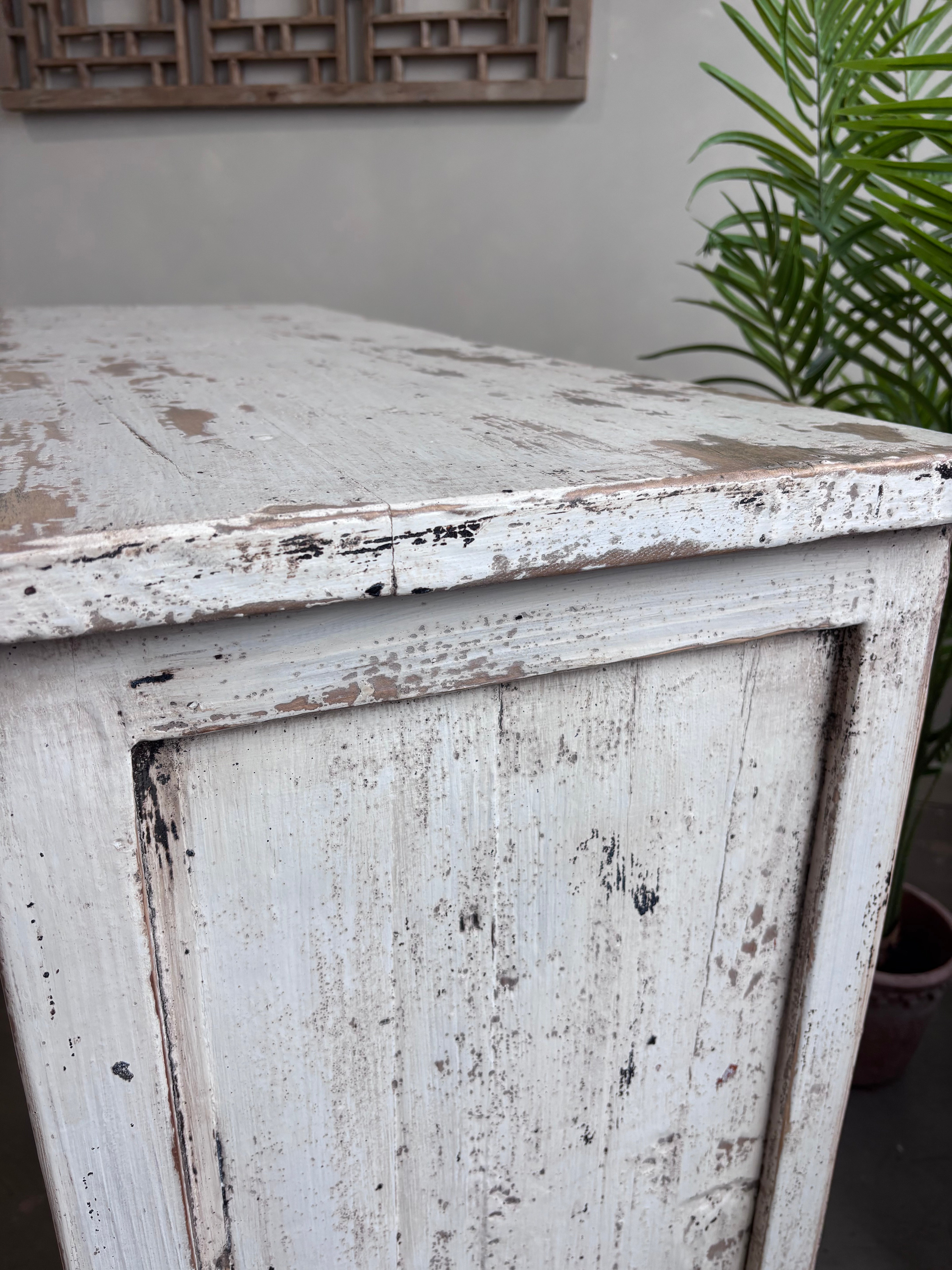 Distressed White Two Door Elm Cabinet with Unique Doors