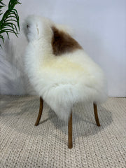 British Rare Breed Sheepskin, natural white with large dark spot