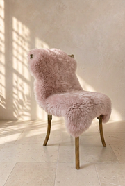Blush pink sheepskin over a chair