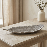 Silver feather tray styled on a pale oak console table